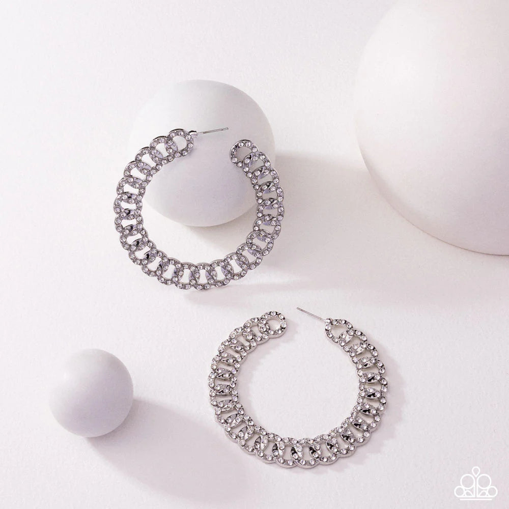 Interlocked Icing - White Rhinestone Silver Link 2 1/2 Inch Hoop Earrings August 2025 Life Of The Party Paparazzi