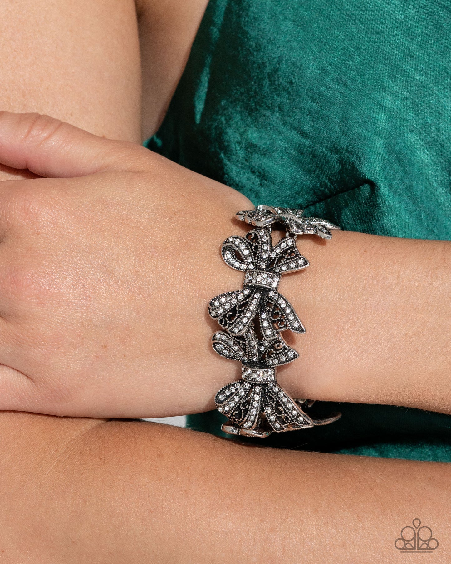 French Flourish - White Rhinestone Bow Stretch Bracelet Life Of The Party October 2024 Paparazzi B1880