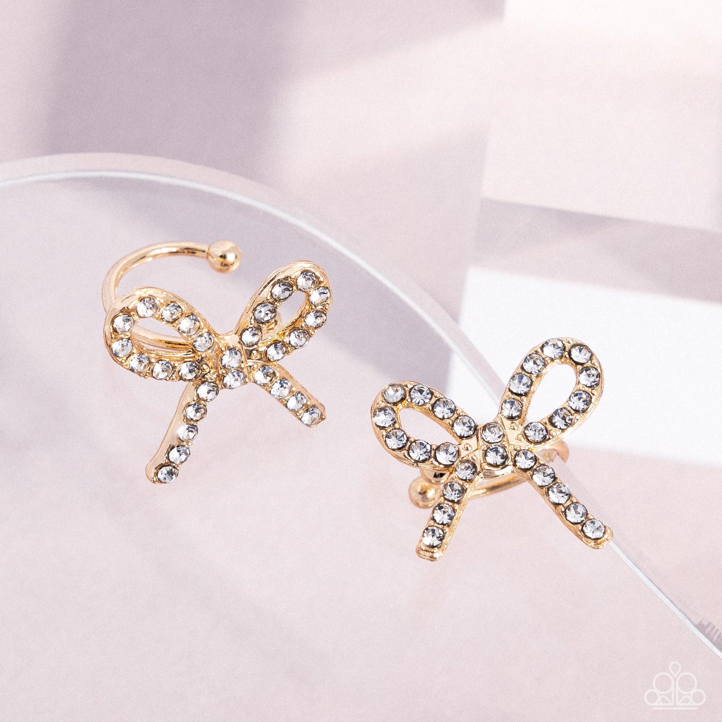 Convincing Charm - Gold Bow Ear Cuff Earring Paparazzi E2616