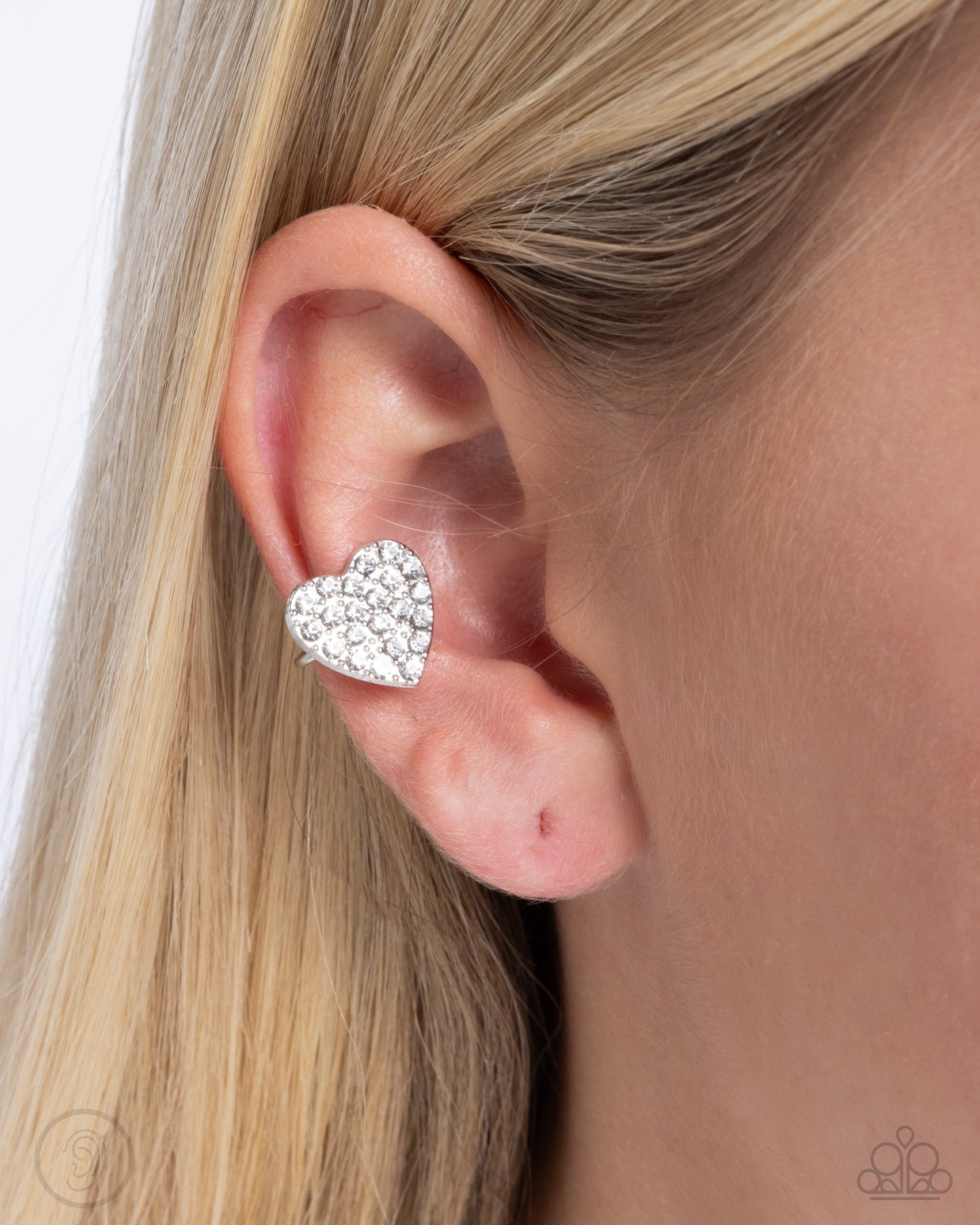 As Far As It GLOWS - White Rhinestone Heart Ear Cuff Paparazzi E2514