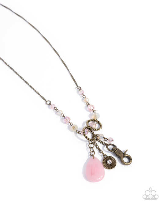 Early Childhood - Brass & Pink Teardrop Stone Charm Style Lanyard Necklace Paparazzi N2652