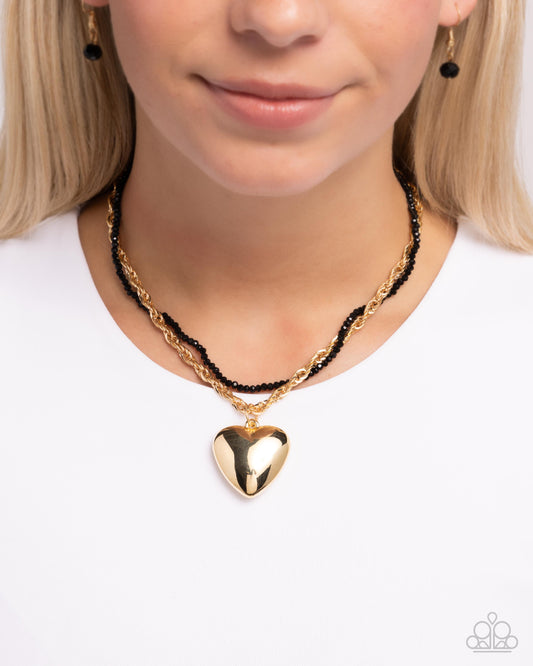 Falling Slowly - Gold Heart Pendant Necklace Paparazzi N2261