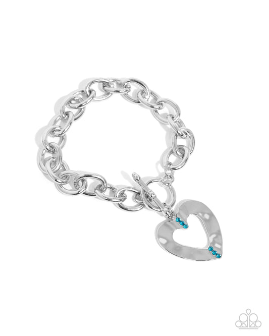 Affectionate Assembly - Blue Zircon Rhinestone & Silver Hammered Heart Bracelet Paparazzi B1860