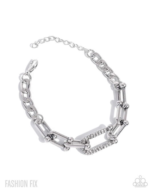 Boosted Bling - White Rhinestone Embellished Silver Link Bracelet Magnificent Musings May 2025 Fashion Fix Paparazzi B2257