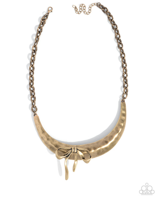 Paparazzi Coquette Cause - Brass Hammered Crescent Frame & Bow Abstract Necklace N2903
