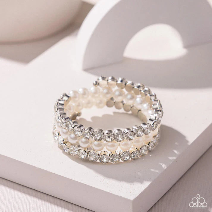 Grandiose Glitz White Rhinestone Coil Bracelet Life Of The Party December 2024 Paparazzi B1915