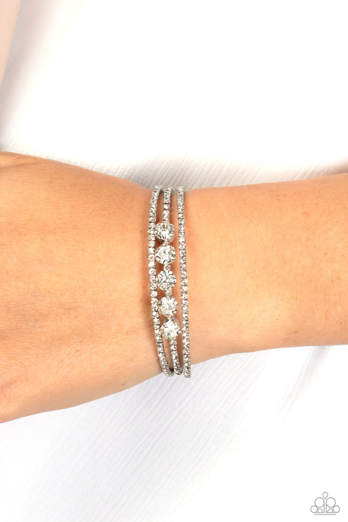 Lucid Layers - White Rhinestone Cuff Bracelet Paparazzi B1099