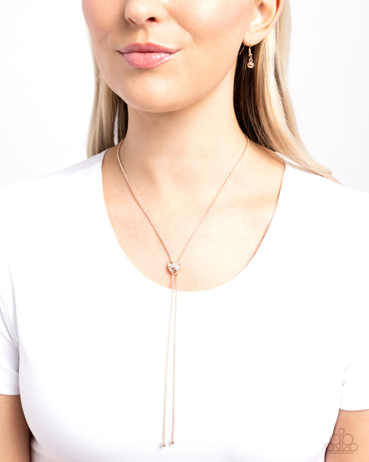 Raised Rose - Rose Gold Chain White Rhinestone Heart Tassel Bolo Style Necklace Paparazzi N2271