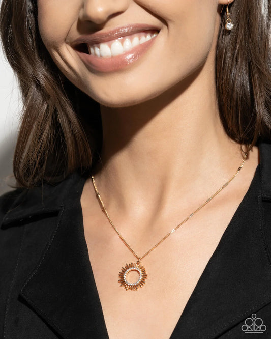 Sunburst Surprise - Gold Sunburst White Rhinestone Pendant Necklace - Paparazzi N2781