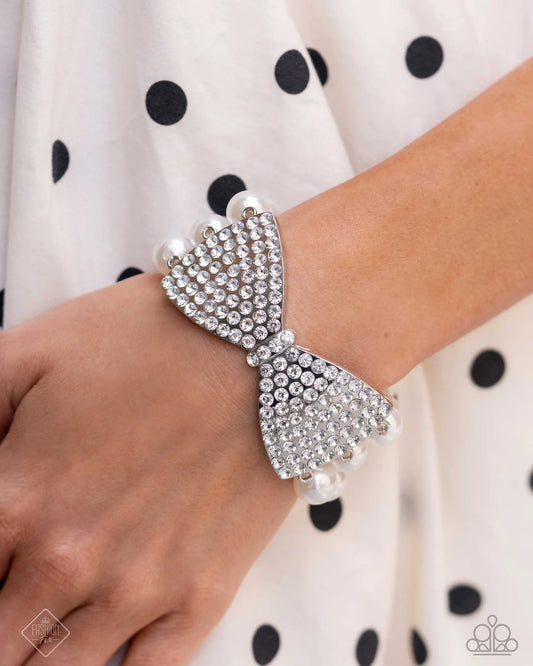 Dashing Demeanor - White Rhinestone Silver Bow Pearl Stretch Bracelet Fiercely 5th Avenue Fashion Fix August 2024 Paparazzi B2412