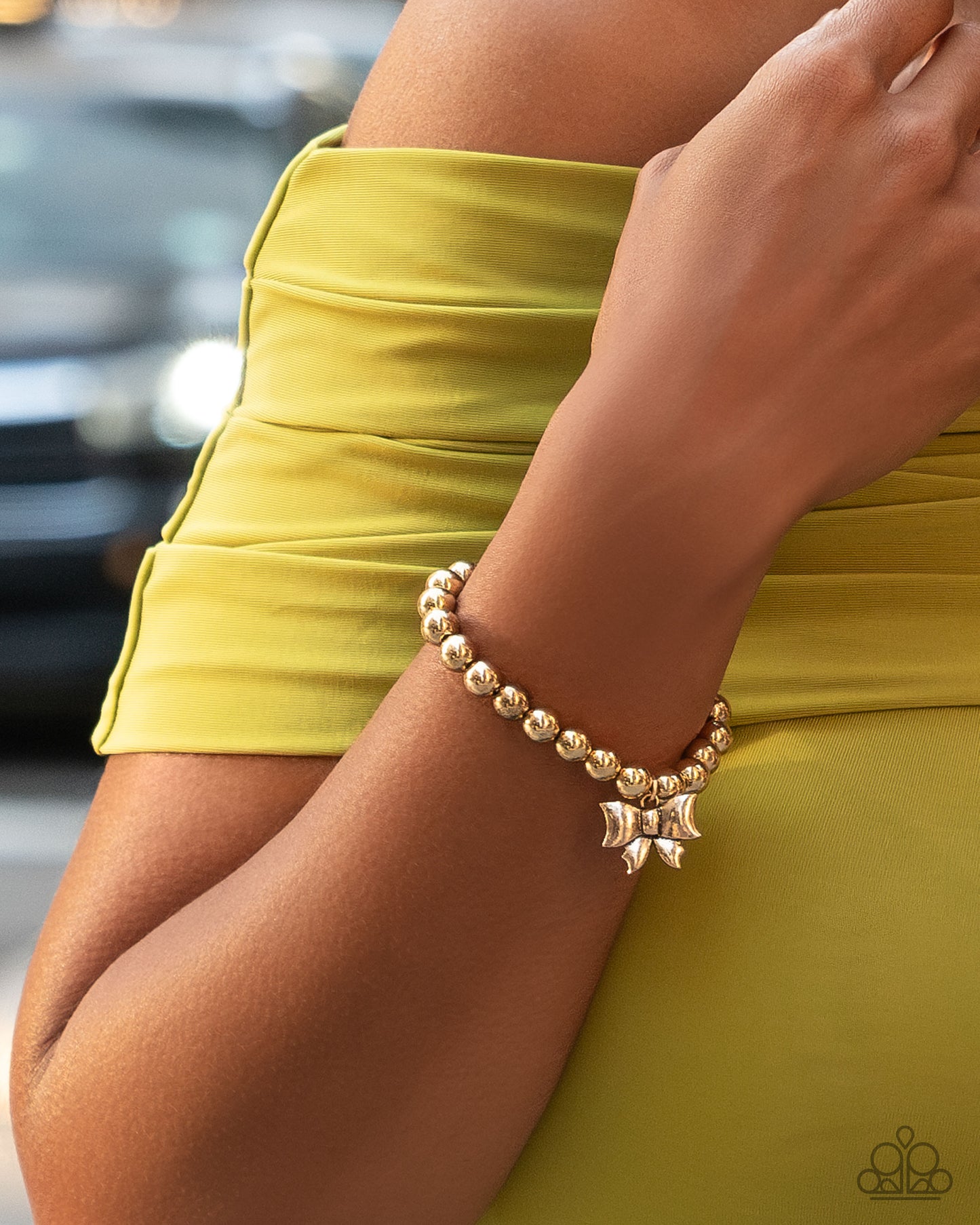 Young Lady - Gold Bead Bow Charm Stretch Bracelet Paparazzi B1997