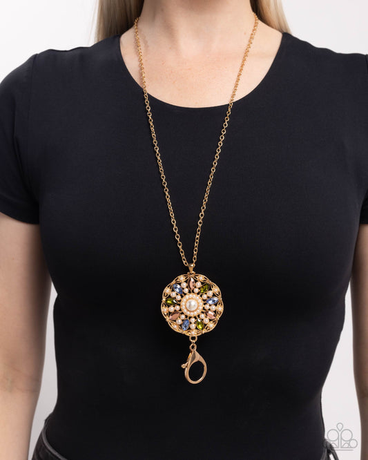 Angelic Arrangement - Gold, White Pearl, Olive, Aurum & Blue Rhinestone Medallion Pendant Lanyard Necklace Paparazzi N2951