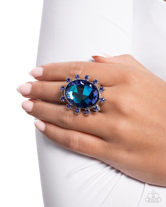 Make a Sound - Blue Sapphire Rhinestones & Blue UV Shimmery Gem Statement Ring Paparazzi R0996