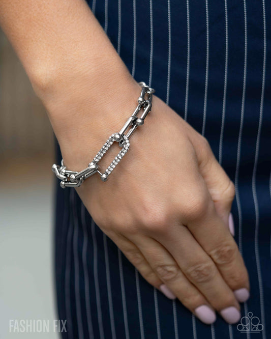 Boosted Bling - White Rhinestone Embellished Silver Link Bracelet Magnificent Musings May 2025 Fashion Fix Paparazzi B2257