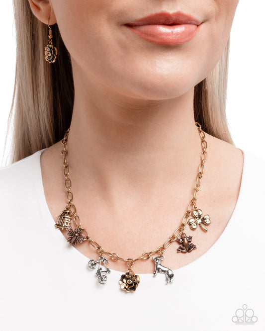 Storyteller Sheen - Multicolored Charms Bird Cage, Bee, Bike, Dog, Frog, Flower Antiqued Gold Necklace Paparazzi N3460