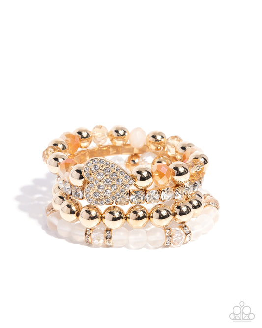 Poetically Plush - White Rhinestone Heart Gold Stretch Set Of 4 Bracelets Paparazzi B2265