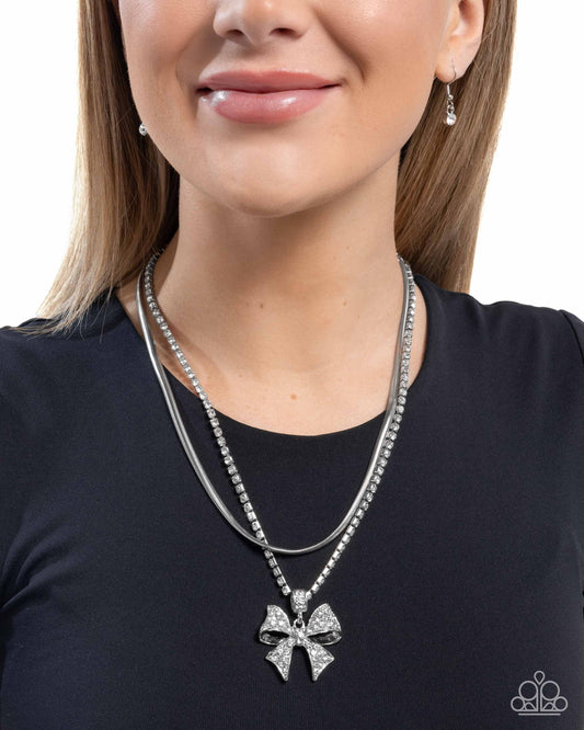 Cheerful Coquette - White Rhinestone Layered Herringbone Chain & Silver Bow Pendant Necklace Paparazzi N3346