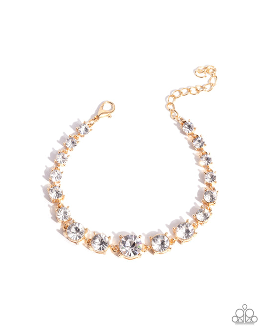 Sizable Shimmer - Gold White Glittery Rhinestone Bracelet Paparazzi B2455