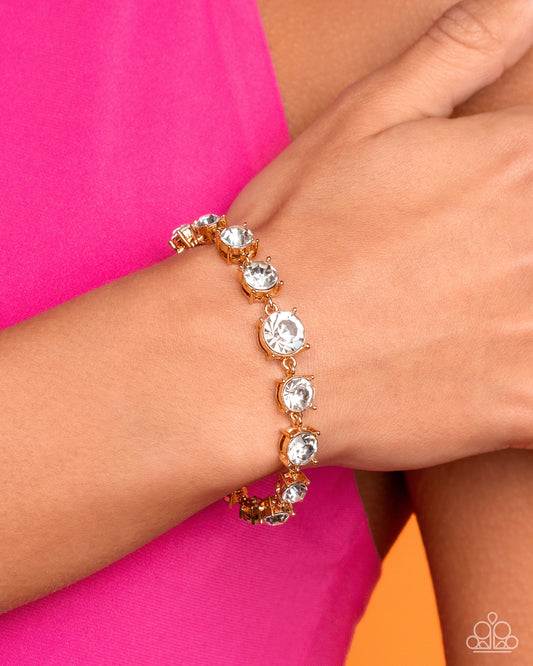 Sizable Shimmer - Gold White Glittery Rhinestone Bracelet Paparazzi B2455