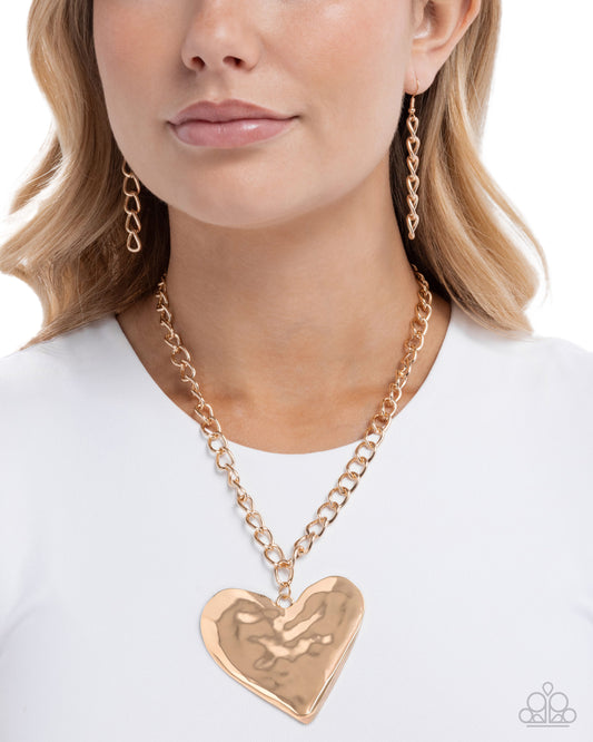 Paparazzi Hammered Heartthrob - Gold Hammered Heart Statement Necklace