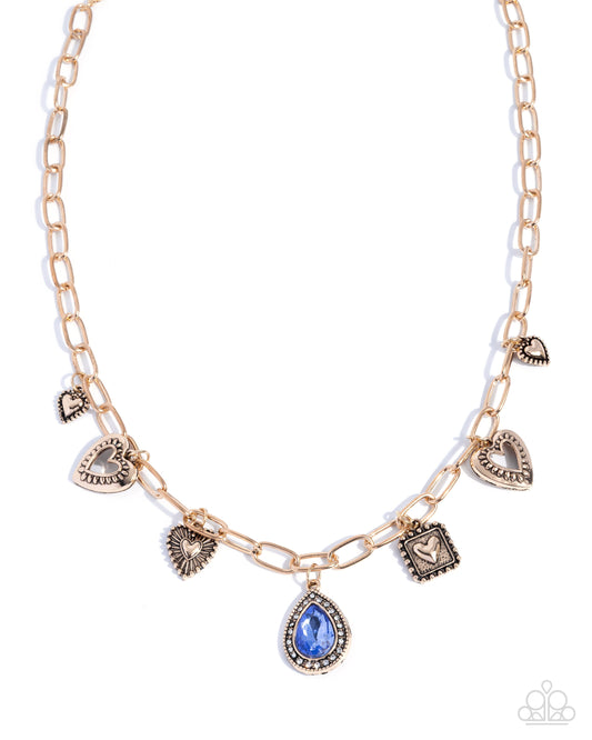 Paparazzi Flirtatious Framing - Blue Teardrop Gem Antiqued Gold Charm Style Necklace