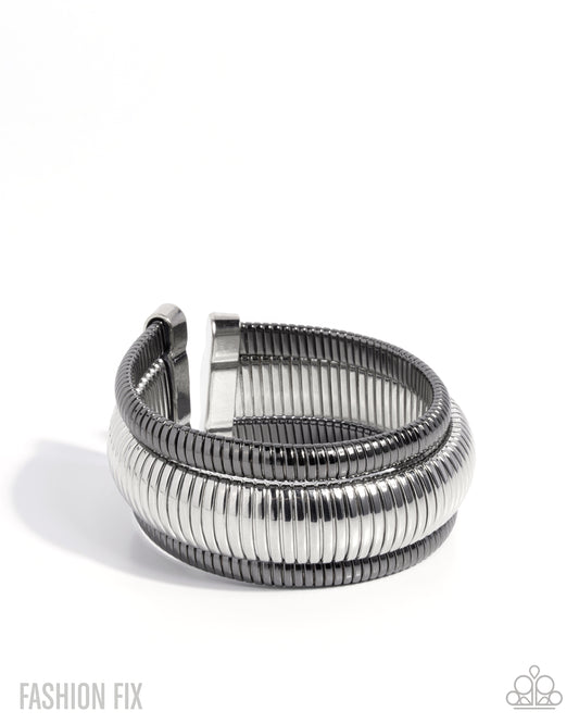 Paparazzi Tactile Takedown - Silver & Gunmetal Flexible Cuff Bracelet Magnificent Musings August 2026 Fashion Fix