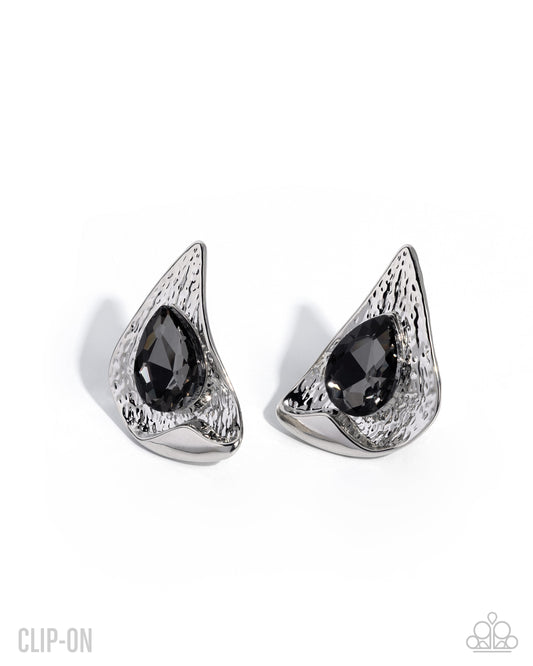 Paparazzi Chic Character - Silver Smoky Teardrop Hammered Silver Clip On Earring 2026 Convention Exclusive