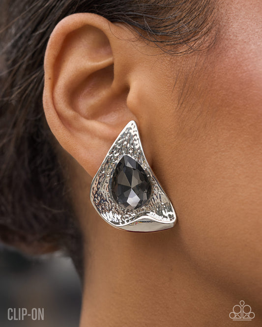 Paparazzi Chic Character - Silver Smoky Teardrop Hammered Silver Clip On Earring 2026 Convention Exclusive