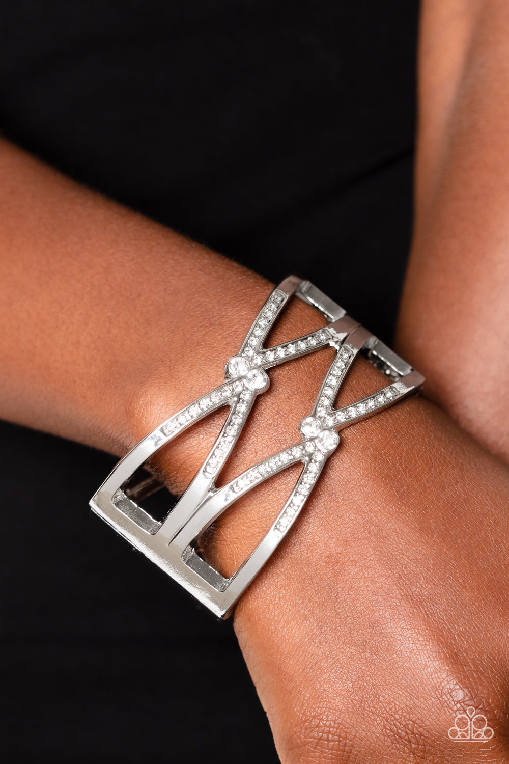 Entrancing Etiquette - White Rhinestone Crossed Ribbons of Silver Hinge Bracelet Paparazzi B1263